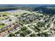 Bird's eye view showcases neighborhood with mix of homes, apartments, and commercial area at 8902 Temple Park Dr, Tampa, FL 33637