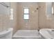 Bathroom featuring tub, shower head, and toilet at 8902 Temple Park Dr, Tampa, FL 33637