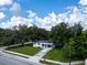 Charming single-story home with beautiful lawn and partial driveway at 8902 Temple Park Dr, Tampa, FL 33637