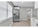Spacious kitchen features stainless steel refrigerator and ample cabinet space at 8902 Temple Park Dr, Tampa, FL 33637