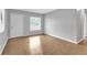 Spacious living area showcasing newly installed laminate wood flooring at 8902 Temple Park Dr, Tampa, FL 33637