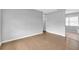 Open living area with laminate wood floors and ample natural light at 8902 Temple Park Dr, Tampa, FL 33637