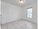 Bright dining room with white tiled floor and a window providing natural light at 107 Seahorse Se Dr # A, St Petersburg, FL 33705