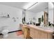 Bright bathroom with double sinks, vanity, and a private toilet room at 1545 Park N St, St Petersburg, FL 33710