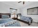 Bedroom with two twin beds, a dark wood nightstand, and bright natural light at 1545 Park N St, St Petersburg, FL 33710