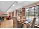 Inviting dining area with large windows, hardwood floors, and stylish decor at 1545 Park N St, St Petersburg, FL 33710