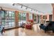 Sunlit living room with hardwood floors, large windows, and views of the swimming pool at 1545 Park N St, St Petersburg, FL 33710