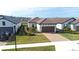 Exterior view of a single-Gathering home with well-manicured lawn, paved driveway, and a two-car garage at 4639 Garofalo Rd, Wesley Chapel, FL 33543