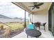 Cozy patio with fan featuring wicker seating offering backyard views for outdoor enjoyment and relaxation at 4639 Garofalo Rd, Wesley Chapel, FL 33543