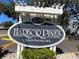 Community sign reading Harbor Pines Condominiums at 6033 34Th W St # 45, Bradenton, FL 34210