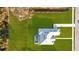 Stunning aerial view of home with pool, luscious green lawn, and paved driveway at 10920 Flint Estates Dr, Thonotosassa, FL 33592