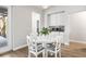 Bright dining area features a white round table and chairs, along with storage and light-filled windows at 10920 Flint Estates Dr, Thonotosassa, FL 33592