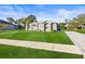 Attractive home featuring stone accents and manicured lawn, complete with a stylish walkway for added elegance at 10920 Flint Estates Dr, Thonotosassa, FL 33592