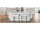 Stylish kitchen island featuring granite countertops and modern seating at 10920 Flint Estates Dr, Thonotosassa, FL 33592