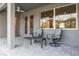 Charming patio with comfortable seating, providing a cozy outdoor space for relaxation and leisure at 10920 Flint Estates Dr, Thonotosassa, FL 33592