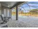 Relaxing outdoor patio with comfortable seating, offering serene views of the pool and surrounding landscape at 10920 Flint Estates Dr, Thonotosassa, FL 33592