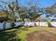 Lush backyard featuring a white privacy fence and fresh landscaping for creating a serene outdoor retreat at 1341 Springdale St, Clearwater, FL 33755