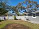 Spacious backyard featuring a white privacy fence and lush landscaping, creating a serene outdoor retreat at 1341 Springdale St, Clearwater, FL 33755