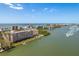 Waterfront condominium featuring private docks, a swimming pool, and ocean access at 19451 Gulf Blvd # 204, Indian Shores, FL 33785