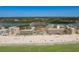 Spectacular overhead view of beachfront condos offering direct access to white sand and ocean waters at 19451 Gulf Blvd # 204, Indian Shores, FL 33785