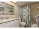 Clean bathroom with vanity, mirror and shower/tub combo for a functional space at 19451 Gulf Blvd # 204, Indian Shores, FL 33785