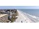 Breathtaking beach view with white sand, clear water, and beachfront condos creating a serene coastal panorama at 19451 Gulf Blvd # 204, Indian Shores, FL 33785