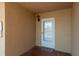 This is the entrance to the condo, with a well-lit entryway and a welcoming doormat at 19451 Gulf Blvd # 204, Indian Shores, FL 33785