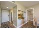 Hallway leading into kitchen area and living room, showcasing the home's layout at 19451 Gulf Blvd # 204, Indian Shores, FL 33785