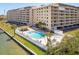 Resort-style condo pool area offering a refreshing escape with lounge seating and adjacent spa at 19451 Gulf Blvd # 204, Indian Shores, FL 33785
