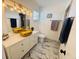 Stylish bathroom with double vessel sinks, modern fixtures, and white marble flooring at 27064 Omni Ln, Punta Gorda, FL 33983
