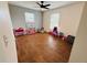 Spacious bedroom with wood floors, neutral walls, and bright natural light at 27064 Omni Ln, Punta Gorda, FL 33983