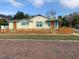 Charming home featuring a picket fence and colorful accents, situated on a brick-paved street at 331 25Th S St, St Petersburg, FL 33712