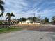 Street view capturing the home's inviting curb appeal with its picket fence and colorful exterior at 331 25Th S St, St Petersburg, FL 33712