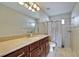 Bathroom featuring a large vanity and shower with curtain at 9413 Swift Creek Cir, Dover, FL 33527
