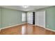 Bedroom with hardwood flooring and a built in closet at 9413 Swift Creek Cir, Dover, FL 33527