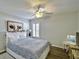 Serene bedroom featuring modern decor, a comfortable bed, and a bright window at 9413 Swift Creek Cir, Dover, FL 33527