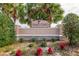 Community entrance sign surrounded by beautiful landscaping and flowers at 9413 Swift Creek Cir, Dover, FL 33527