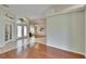 Open-concept foyer with decorative lighting and hardwood flooring at 9413 Swift Creek Cir, Dover, FL 33527