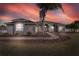 Beautiful home at sunset, featuring manicured landscaping and a welcoming entrance at 9413 Swift Creek Cir, Dover, FL 33527