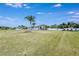 Well-manicured front yard featuring a spacious lawn and a beautiful home at 9413 Swift Creek Cir, Dover, FL 33527