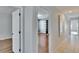Hallway with tile flooring leading to bedroom featuring built-in closet at 9413 Swift Creek Cir, Dover, FL 33527