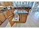 Kitchen with island mixer stand, granite counters, and custom cabinetry at 9413 Swift Creek Cir, Dover, FL 33527