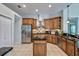 Well-equipped kitchen with stainless steel appliances, granite countertops, and custom cabinetry at 9413 Swift Creek Cir, Dover, FL 33527