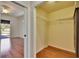 Spacious walk-in closet with wood floors, wire shelving, and ample storage space at 9413 Swift Creek Cir, Dover, FL 33527