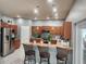 This bright kitchen features pendant lighting, stainless steel appliances, and ample cabinet space at 1919 Blue River Rd, Holiday, FL 34691