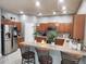 This bright kitchen features pendant lighting, stainless steel appliances, and ample cabinet space at 1919 Blue River Rd, Holiday, FL 34691