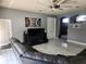 Spacious living room with modern decor, tile flooring, and comfortable sectional seating at 1919 Blue River Rd, Holiday, FL 34691