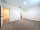A neutral primary bedroom features carpeted floors, ensuite bathroom, and walk-in closet at 32535 Turtle Grace Loop, Wesley Chapel, FL 33545