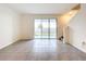 Bright living room with sliding glass door to the backyard, showcasing the open and airy layout at 32535 Turtle Grace Loop, Wesley Chapel, FL 33545