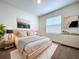 Charming primary bedroom featuring a comfortable bed, natural light, and stylish furnishings at 32535 Turtle Grace Loop, Wesley Chapel, FL 33545
